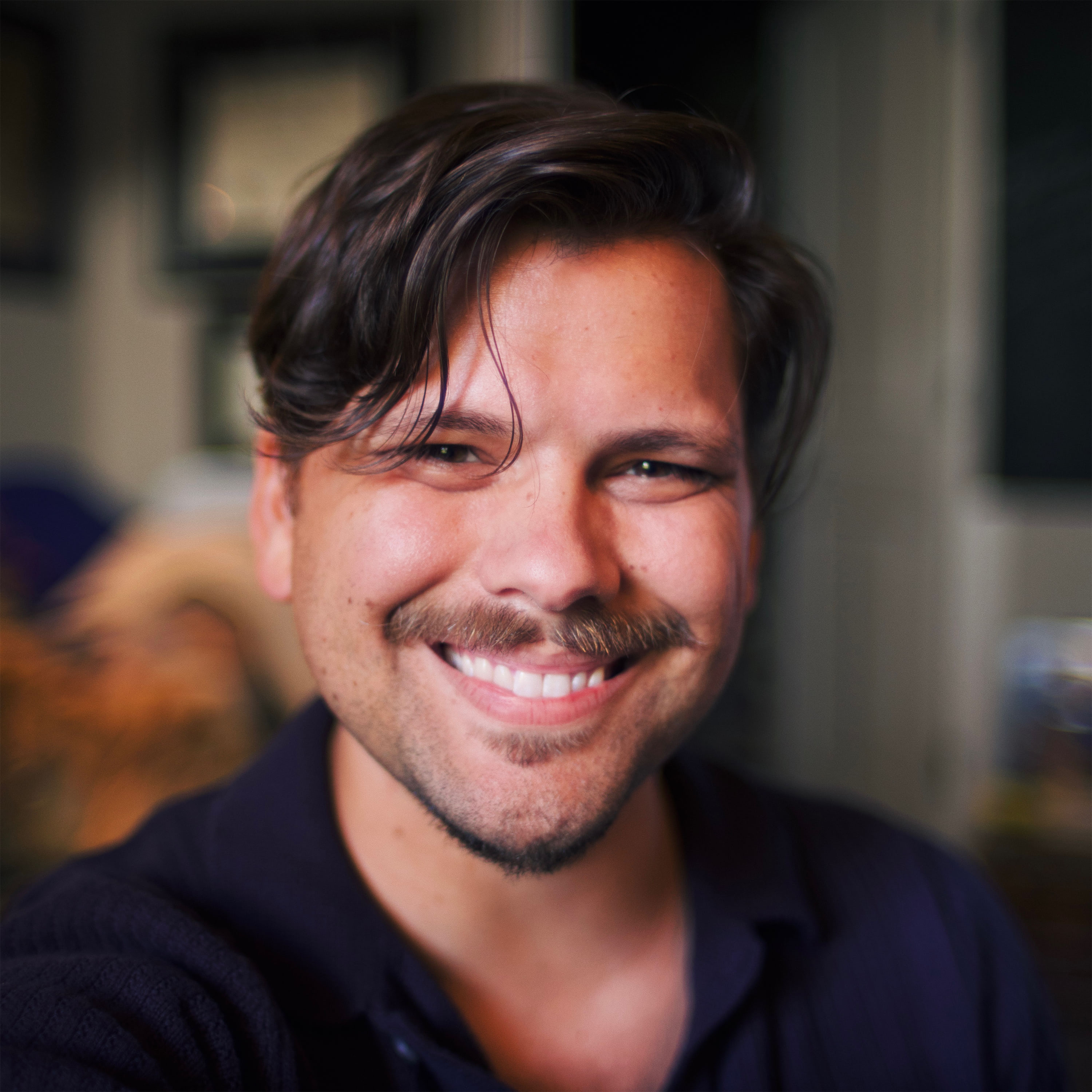 Davy Mellado smiling at the camera
